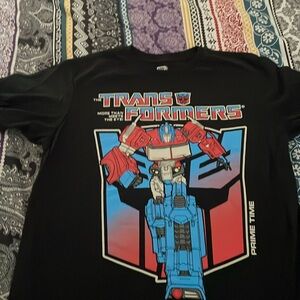 A black red and blue transformers graphic T-shirt size extra large 14/16 big kid